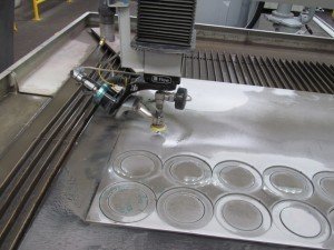 Water-jet cutting gaskets and shim rings